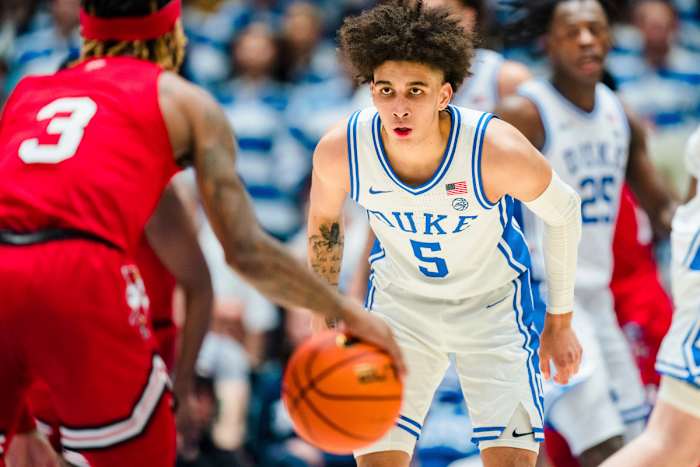 Duke’s Tyrese Proctor guards against Louisville guard El Ellis.